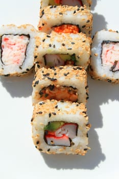 Close up of sushi assortment on a platter.
