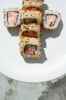 Close up of sushi assortment on a platter.
