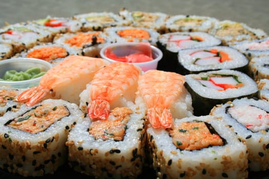 Close up of sushi assortment on a platter.

