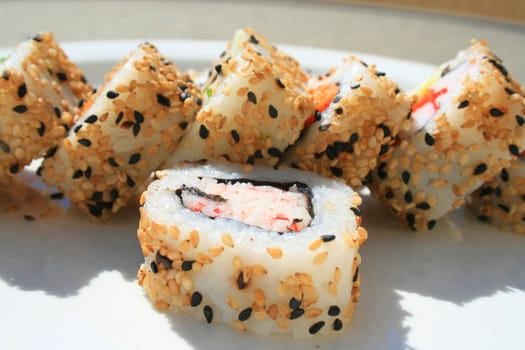 Close up of sushi assortment on a platter.
