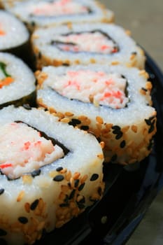 Close up of sushi assortment on a platter.
