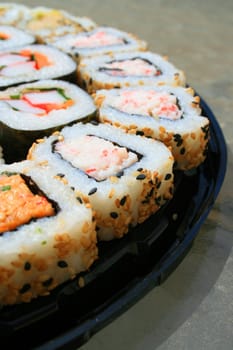 Close up of sushi assortment on a platter.
