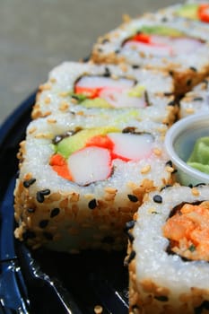 Close up of sushi assortment on a platter.
