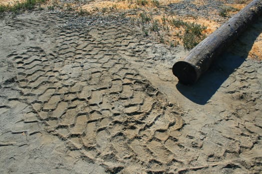 Close up of tire tracks on a road.
