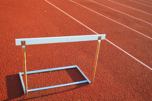 Close up of a track and field hurdle on sunny day.
