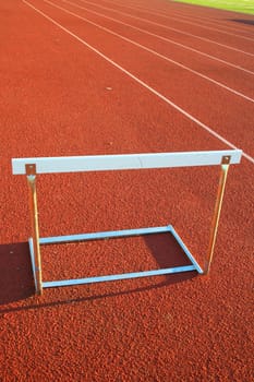Close up of a track and field hurdle on sunny day.
