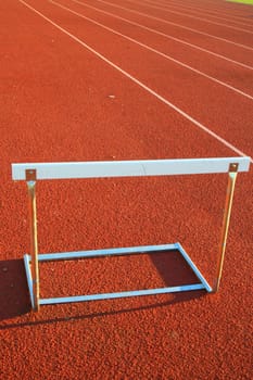 Close up of a track and field hurdle on sunny day.
