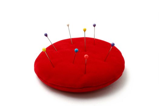 a red pin cushion isolated on white background