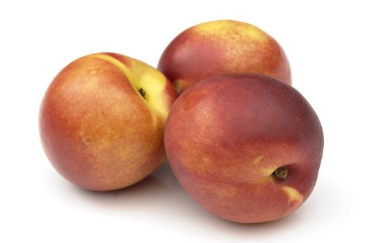 nectarines on the white background 