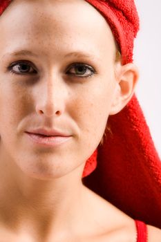 Studio portrait of a beautifull girl with a towel on her head