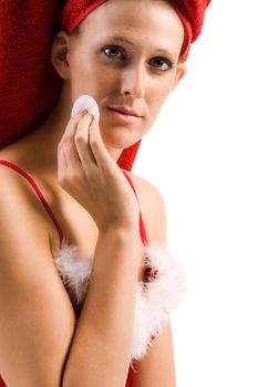 Studio portrait of a beautifull girl who is cleaning her face
