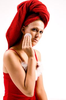 Studio portrait of a beautifull girl who is removing her make-up