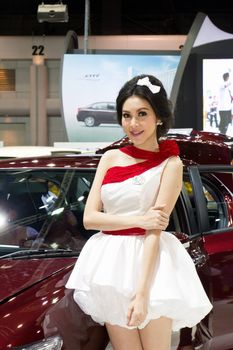 NONTABURI,THAILAND - DECEMBER 3,2011: Unidentified female presenter at Honda booth  Thailand International Motor Expo 2011 on December 3, 2011 in Nonthaburi, Thailand.