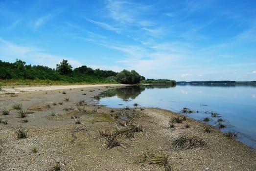 Receded Danube river waters in hot summer