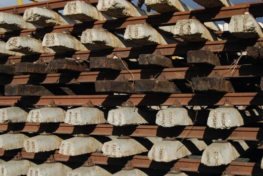 Rows of ferro-concrete and wood cross-ties and steel rails