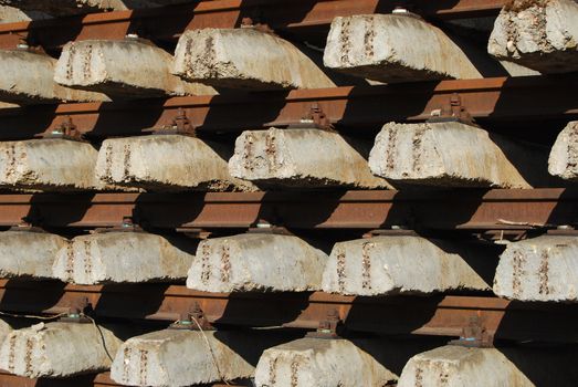 Rows of ferro-concrete cross-tie and steel rails close-up