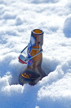 Beer bottle in snow