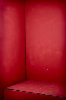 Red dark corner with vignette and old walls. Good for gift or text placement 