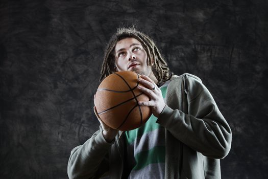 Basketball player taking the shot with a basketball