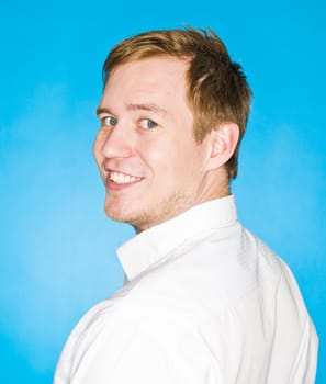 Portrait of a young man on blue background