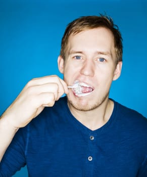 Close up of a man brushing teeths