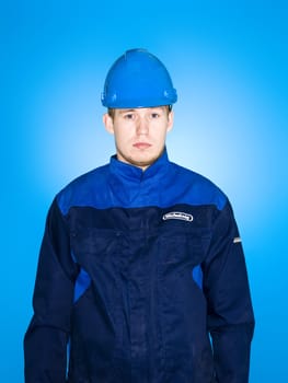 Portrait of a Manual Worker on blue background