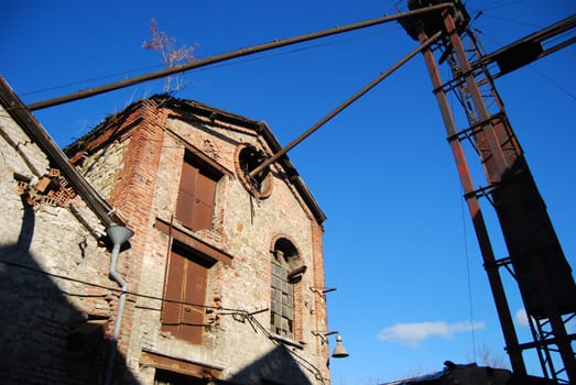 Old ruined factory construction from below view