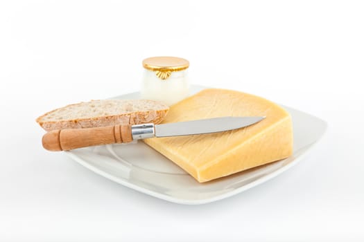 Traditional bread and cheese with yogurt isolated on white background.