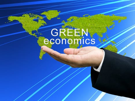 Green economics on businessman's hand