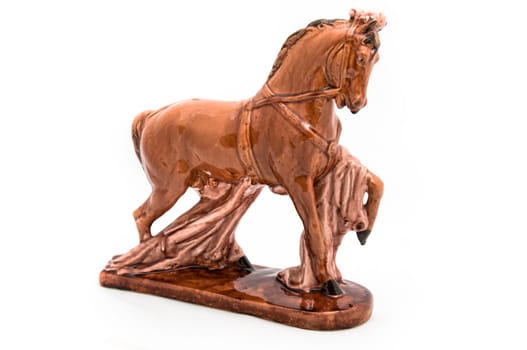 Glossy and old statuette of royal, brown, beautiful horse