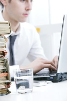 Young businessman at desk in his office