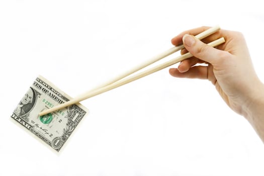 Chinese chopsticks holding American dollar