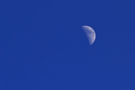 Moon in a clear blue sky