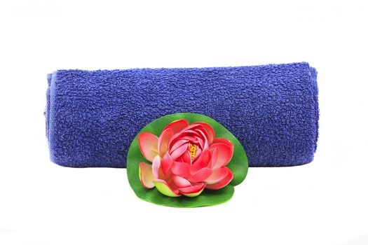 Beautiful decoration with blue towel and red flower isolated on white