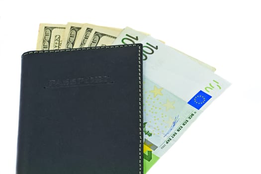 Passport and money, a travelers essential kit, isolated on white background