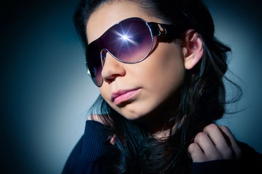 Portrait of a young girl in sunglasses