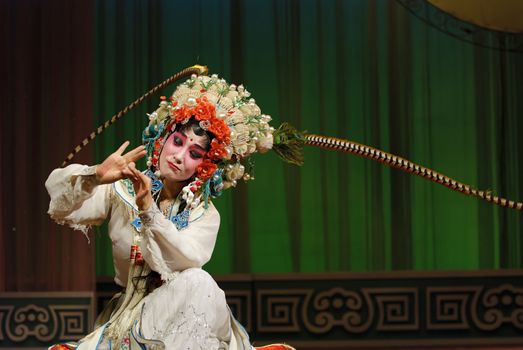 Chinese opera actress perform on stage.