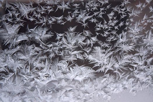 View of  frost on  glass window. Image with shallow depth of field.