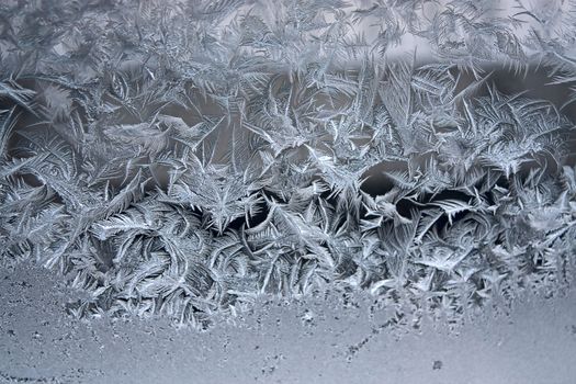 View of  frost on  glass window. Image with shallow depth of field.