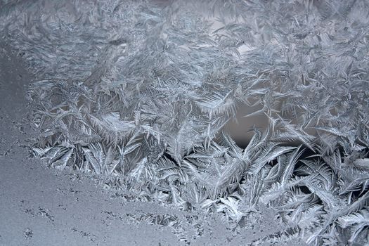 View of  frost on  glass window. Image with shallow depth of field.