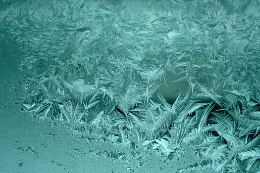 View of  frost on  glass window. Image with shallow depth of field.