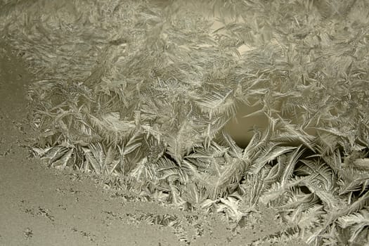 View of  frost on  glass window. Image with shallow depth of field.