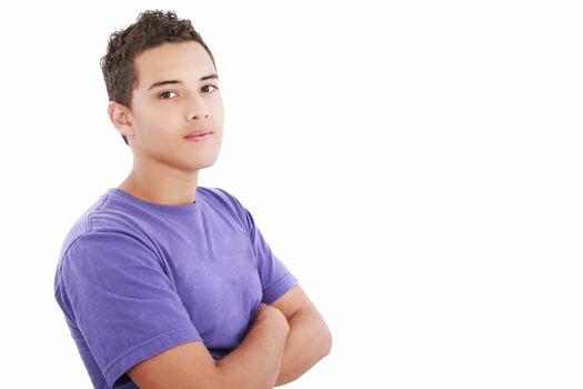 Portrait of a happy teenager standing with folded hands on isolated background