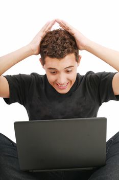 young man shocked with something he see on his laptop computer