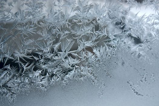 View of  frost on  glass window. Image with shallow depth of field.