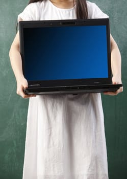 girl holding a heavy laptop