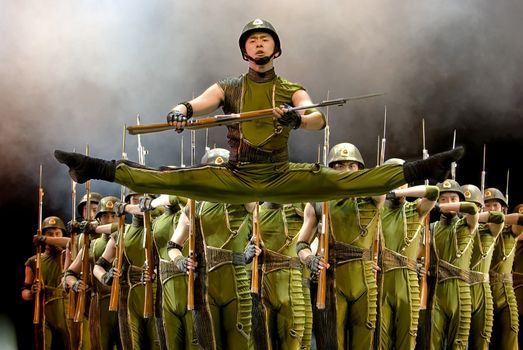 CHENGDU - DEC 13: Group dance show "soldiers and gun" performed by ZONGZHENG dance troupe at JINCHENG theater in the 7th national dance competition of china on Dec 13,2007 in Chengdu, China.