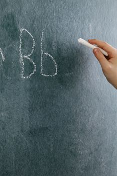 stock image of the little girl writting abc