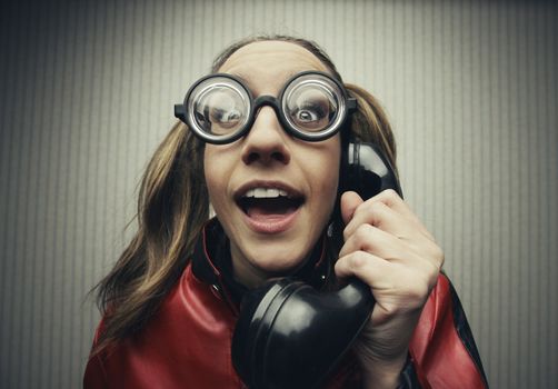 funny nerd humor woman talking retro vintage black telephone on vintage wallpaper