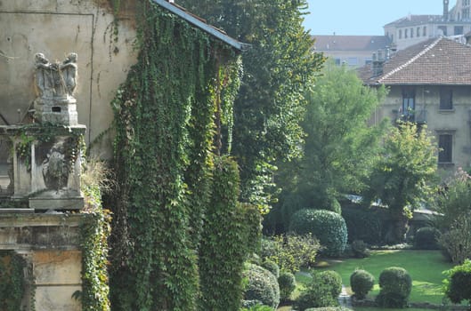 Traditional classical garden with meadow and ivy